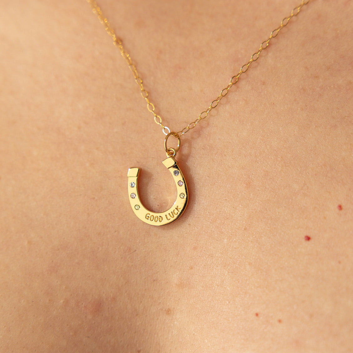 Good Luck Horseshoe Charm Necklace in Gold | The Land of Salt