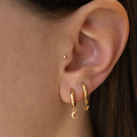 Star and Moon Huggie Hoop Earrings in Gold The Land of Salt